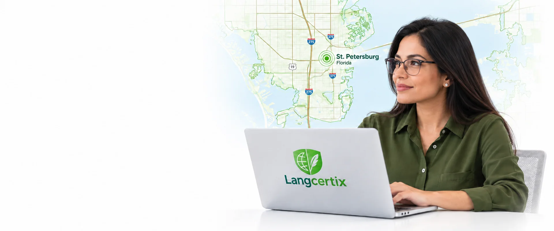 Translator wearing glasses and a green shirt looking left, with a LangCertix laptop and an illustrated map of St. Petersburg, Florida.